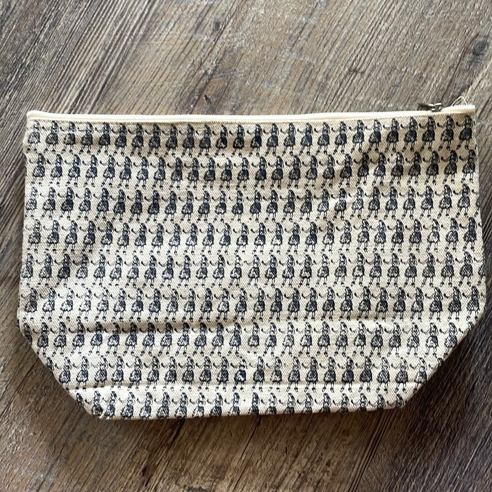 Large canvas zipper tote with hula girl print.